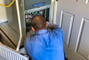 Desert Tech Technician performing maintenance at a customer's home